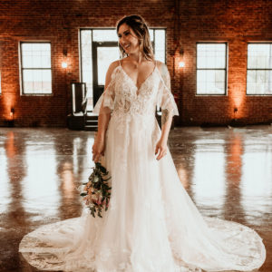 bride wearing flowing white wedding dress