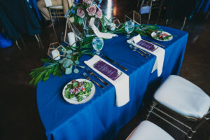sweetheart table decorated with plants and flowers