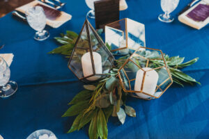 reception table with geometric candle holders