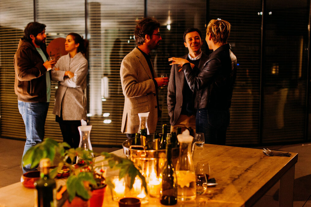 people chatting at a bar